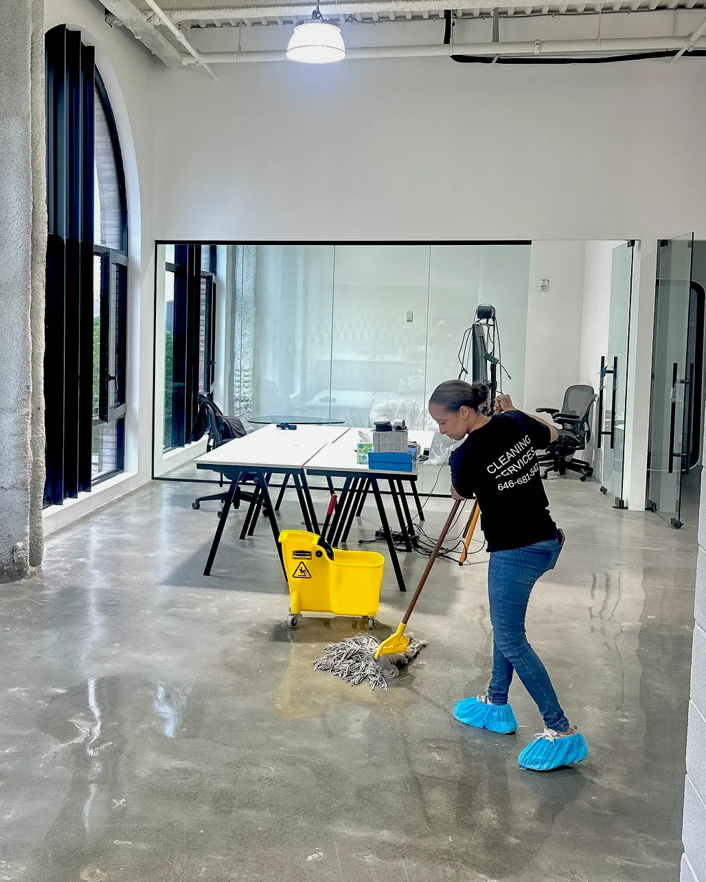 GermSmart cleaner mopping a polished commercial event space