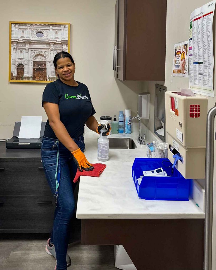 woman cleaning a desk