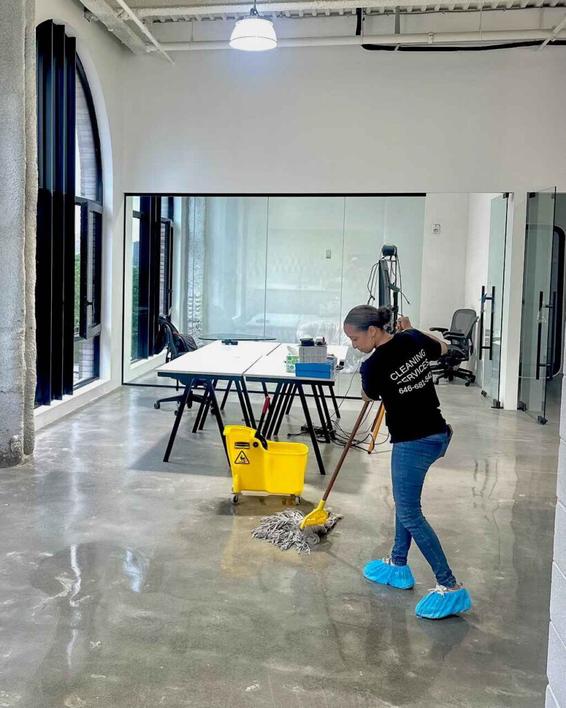 woman mopping an office in New York